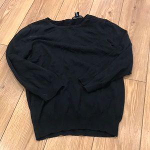 Black sweater with pear accent on back